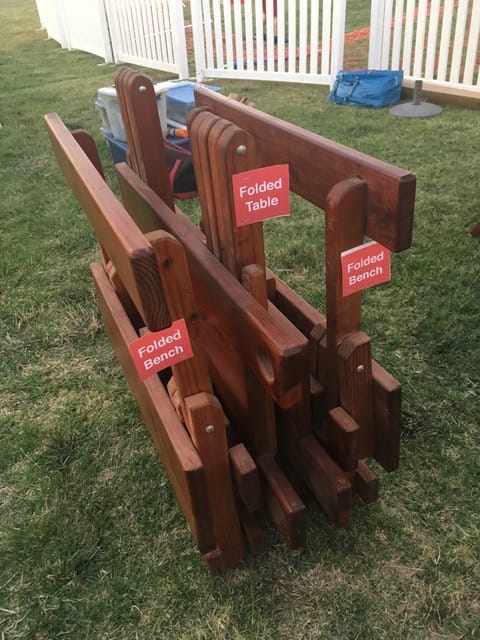 folded table & benches with signs folded table & benches with signs